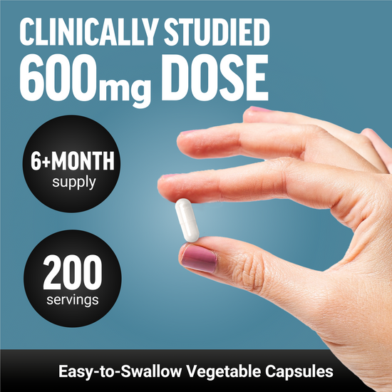 A hand holding a 600mg NAC vegetable capsule, highlighting its clinically studied dose and easy-to-swallow design.