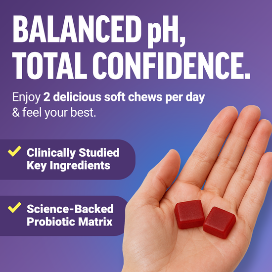 Hand holding two red soft chews, promoting balanced pH and confidence
