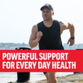 Man running by the water, promoting powerful support for everyday health.