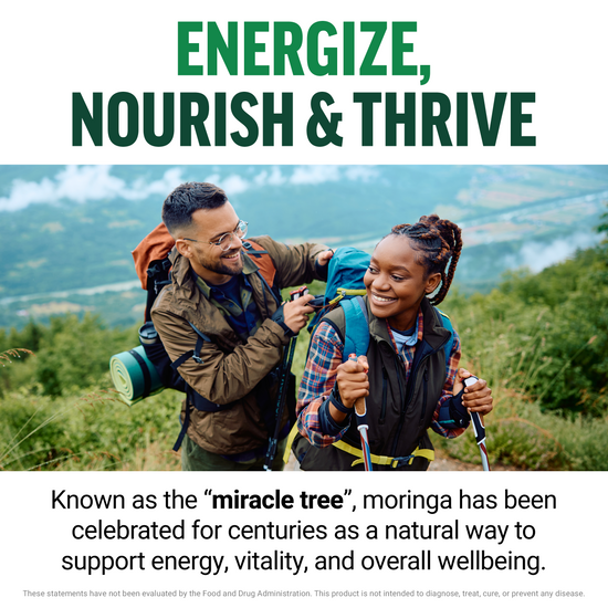 Two hikers smiling outdoors with text about moringa as the miracle tree supporting energy and vitality