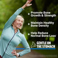 Smiling woman stretching outdoors with benefits listed: promote bone growth and strength, maintain healthy bone density, help reduce normal bone loss, and gentle on the stomach