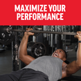 Man lifting weights in a gym with text "MAXIMIZE YOUR PERFORMANCE" in bold red above.