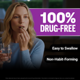 Woman taking Somnapure tablet with water beside bold 100% drug-free, easy to swallow, non-habit-forming claims.