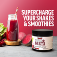 Total Beets tub and beet smoothie beside text promoting supercharging shakes and smoothies.