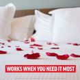 Bedroom scene with rose petals on white sheets and headline stating works when you need it most