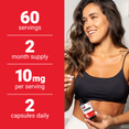 Smiling woman in fitness wear holding Spermidine bottle next to supplement facts showing serving size, dosage, and duration