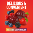 Passion berry flavored black maca gummies shown with strawberries, blueberries, raspberries, and blackberries on red background