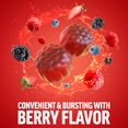 Berry-flavored supplements surrounded by various berries on a vibrant red background.