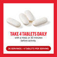 Four white tablets on a red background with dosage instructions for daily intake and servings.